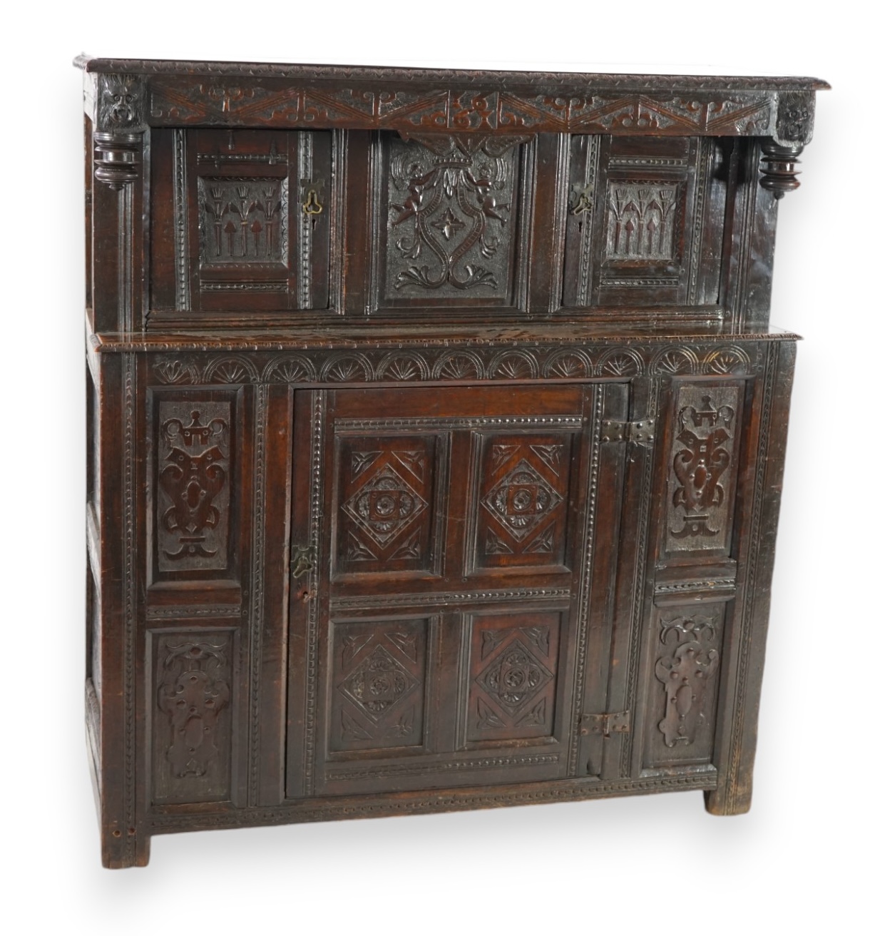 A 17th century and later oak court cupboard